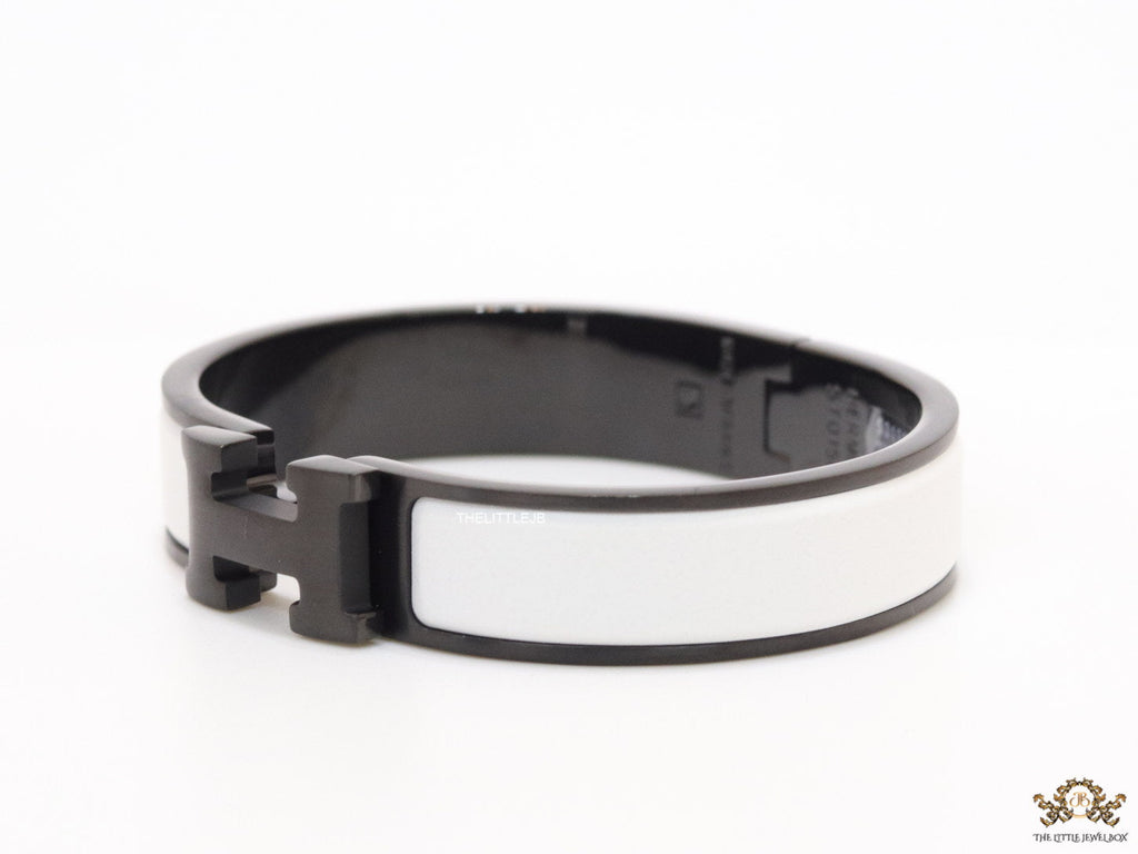 Premium collection band style bracelet in matt white with black metallic details and black T alphabet motif