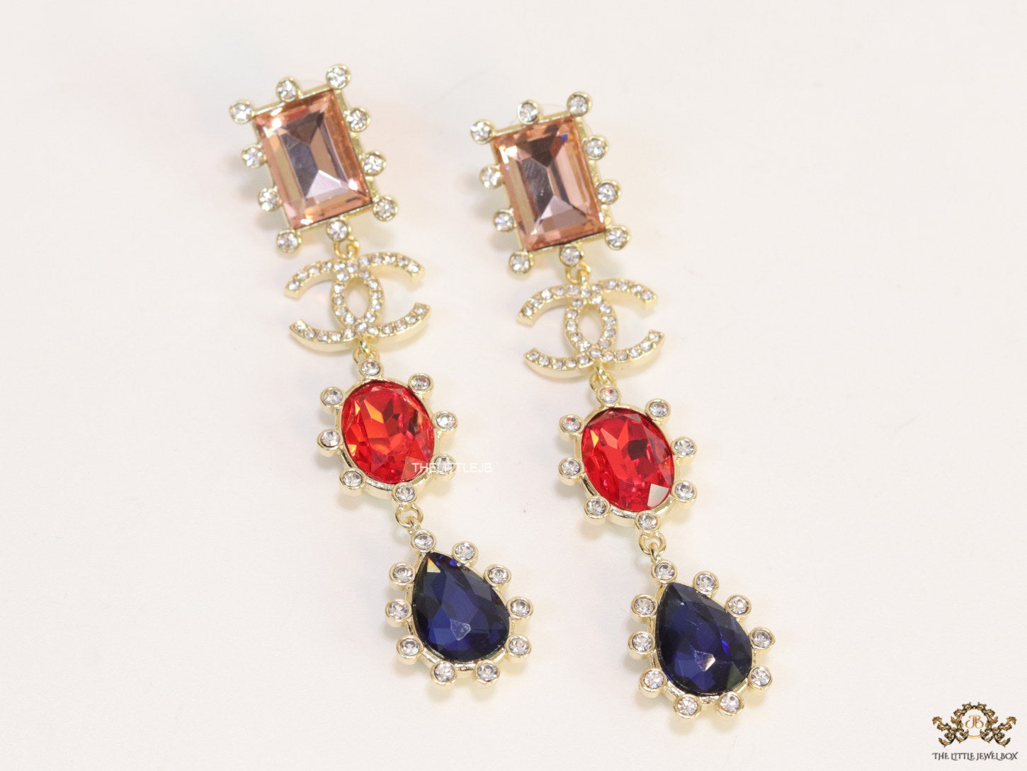 Gold plated cz dangles with red and blue stones and fancy cut cz