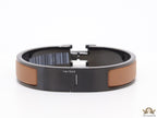 Premium collection band style bracelet in matt tan with black metallic details and black T alphabet motif