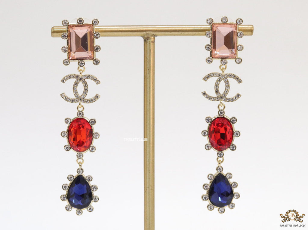 Gold plated cz dangles with red and blue stones and fancy cut cz