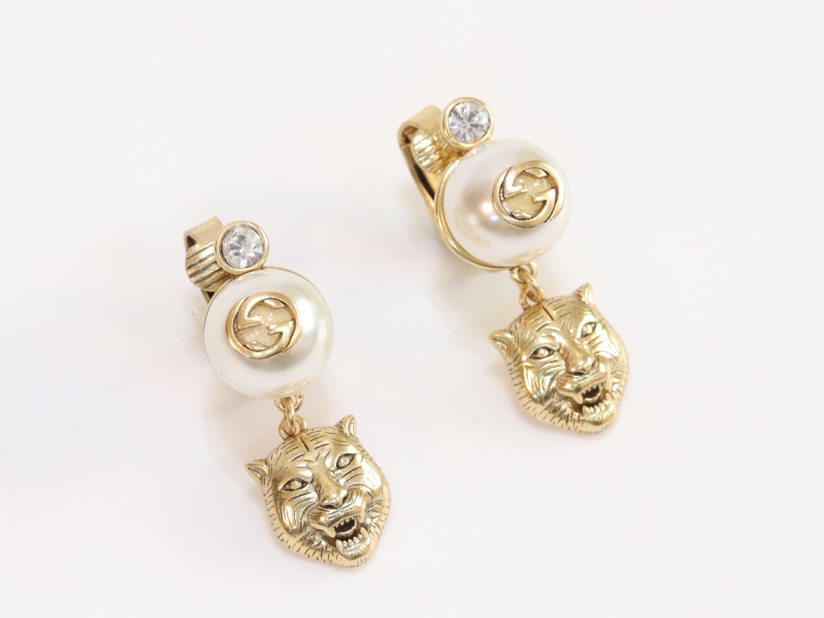 Double G panther pearl dangles in gold finish with CZ