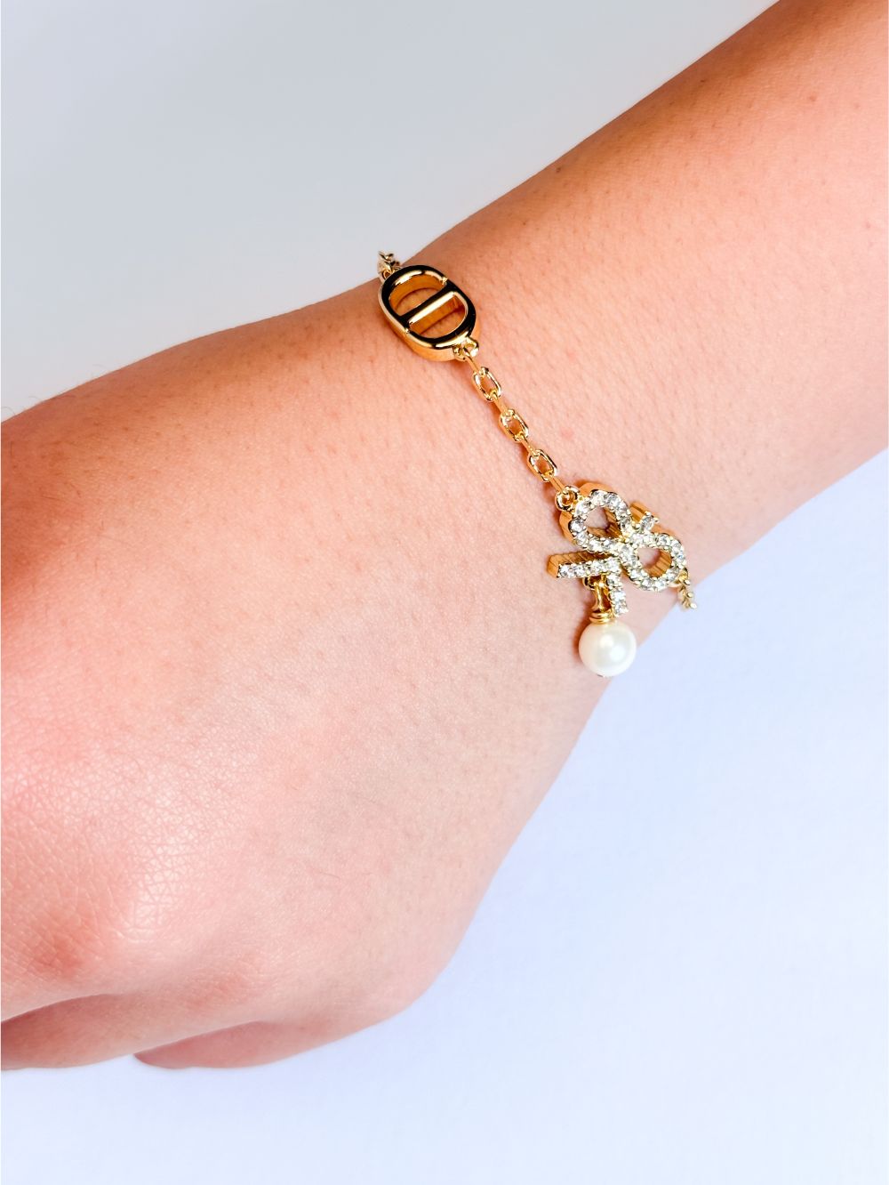 Gold Bow CZ Bracelet with Pearl Charm