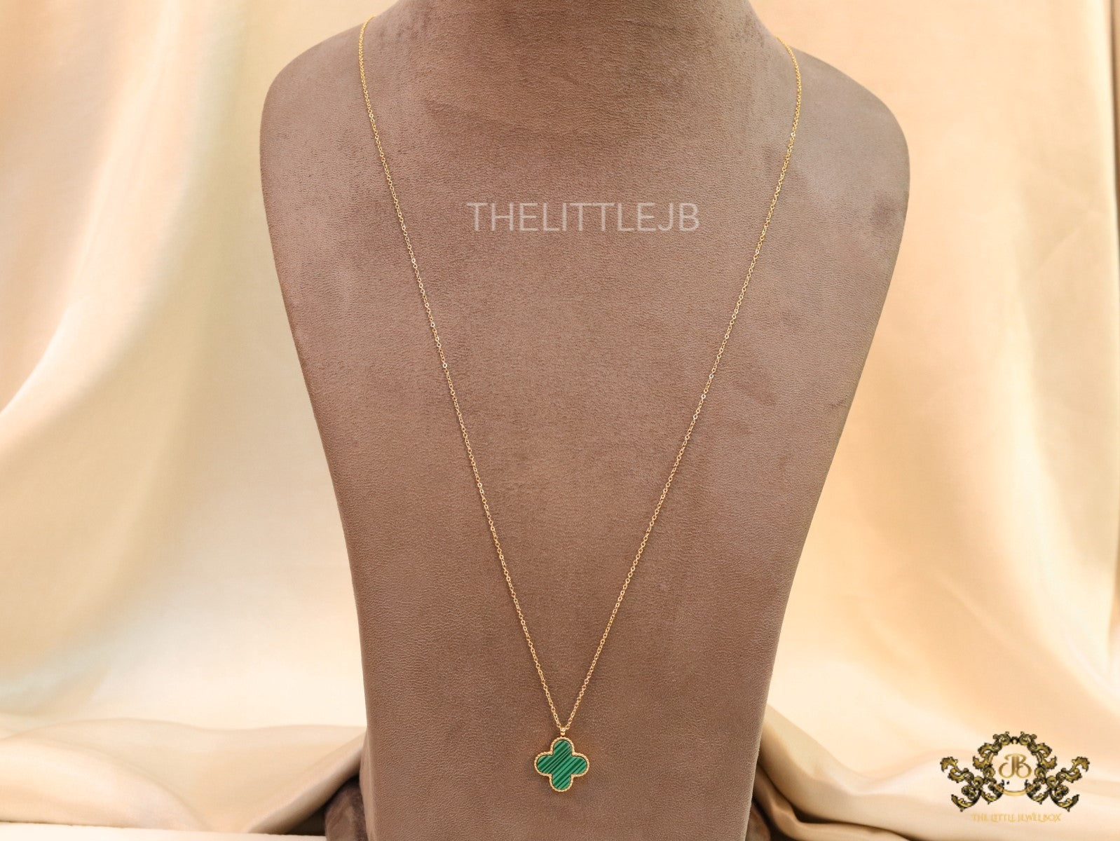Gold plated chain with malachite stone clover pendant