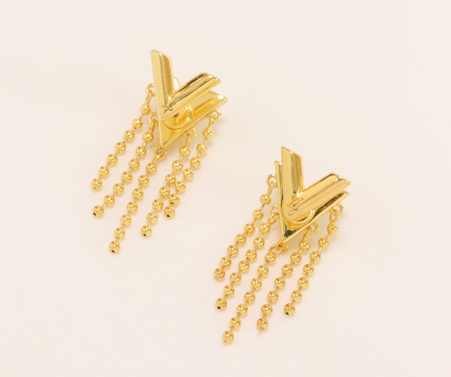 Alphabet v stud with dangles in gold finish