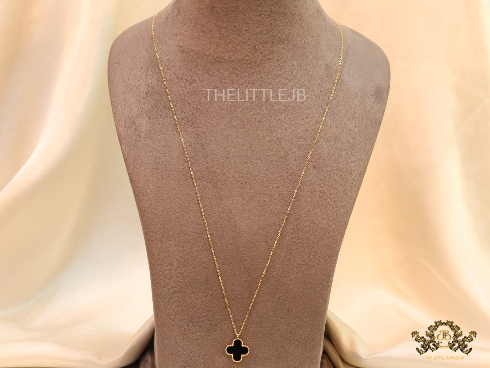 Gold plated chain with black onyx clover pendant