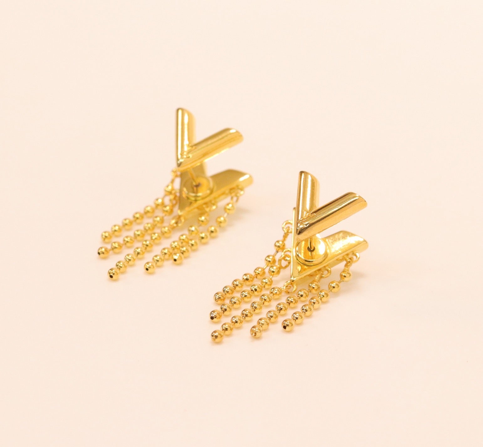 Alphabet v stud with dangles in gold finish