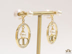 Golden cz round dangles with alphabets and pearl bomber pattern