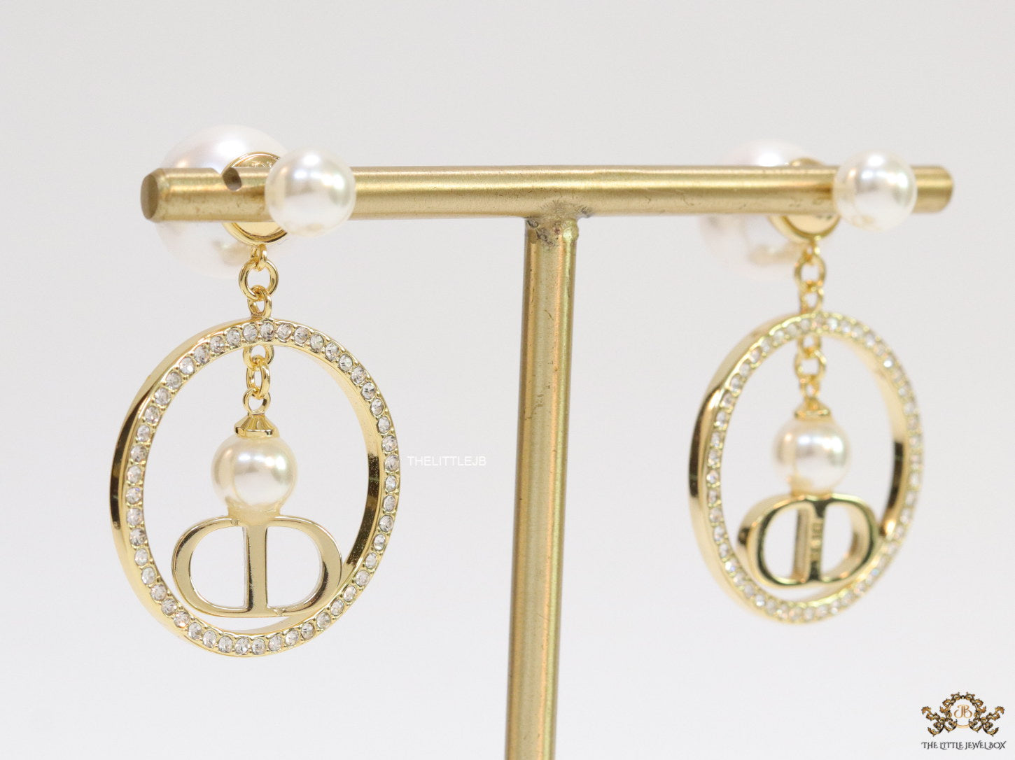 Golden cz round dangles with alphabets and pearl bomber pattern