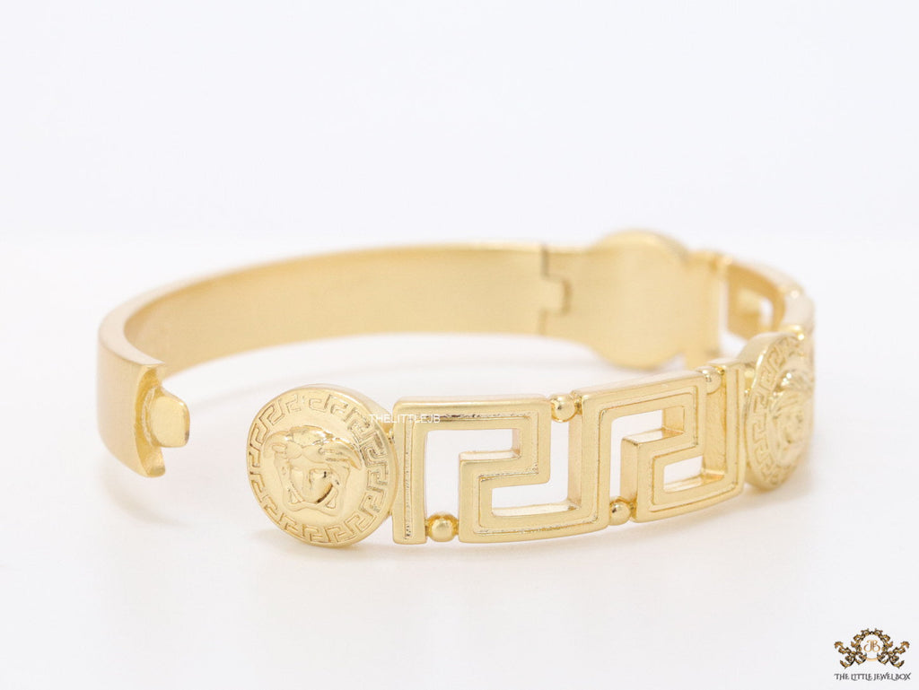 Gold plated designer bracelet with gold plated Medusa face motif