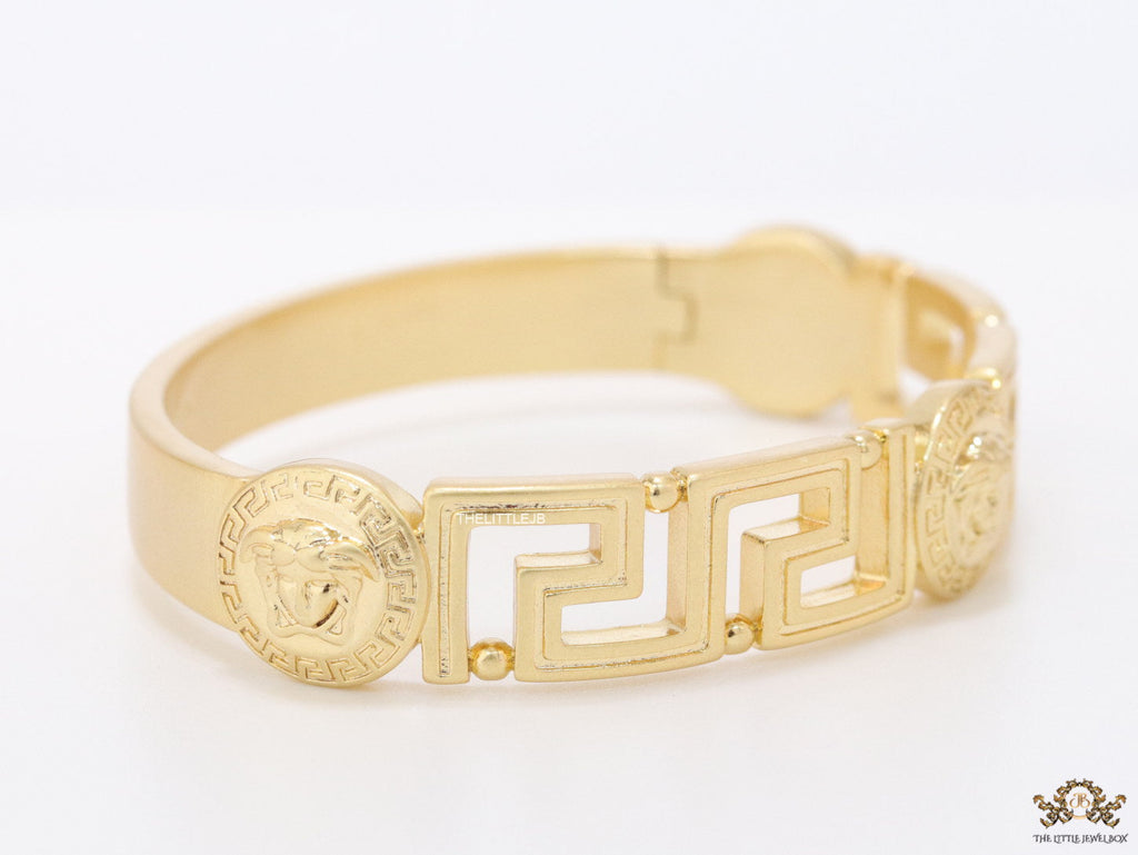 Gold plated designer bracelet with gold plated Medusa face motif
