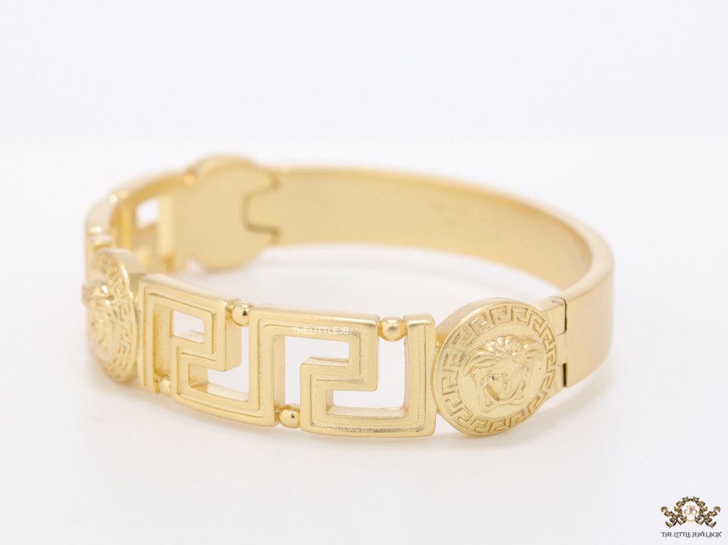 Gold plated designer bracelet with gold plated Medusa face motif