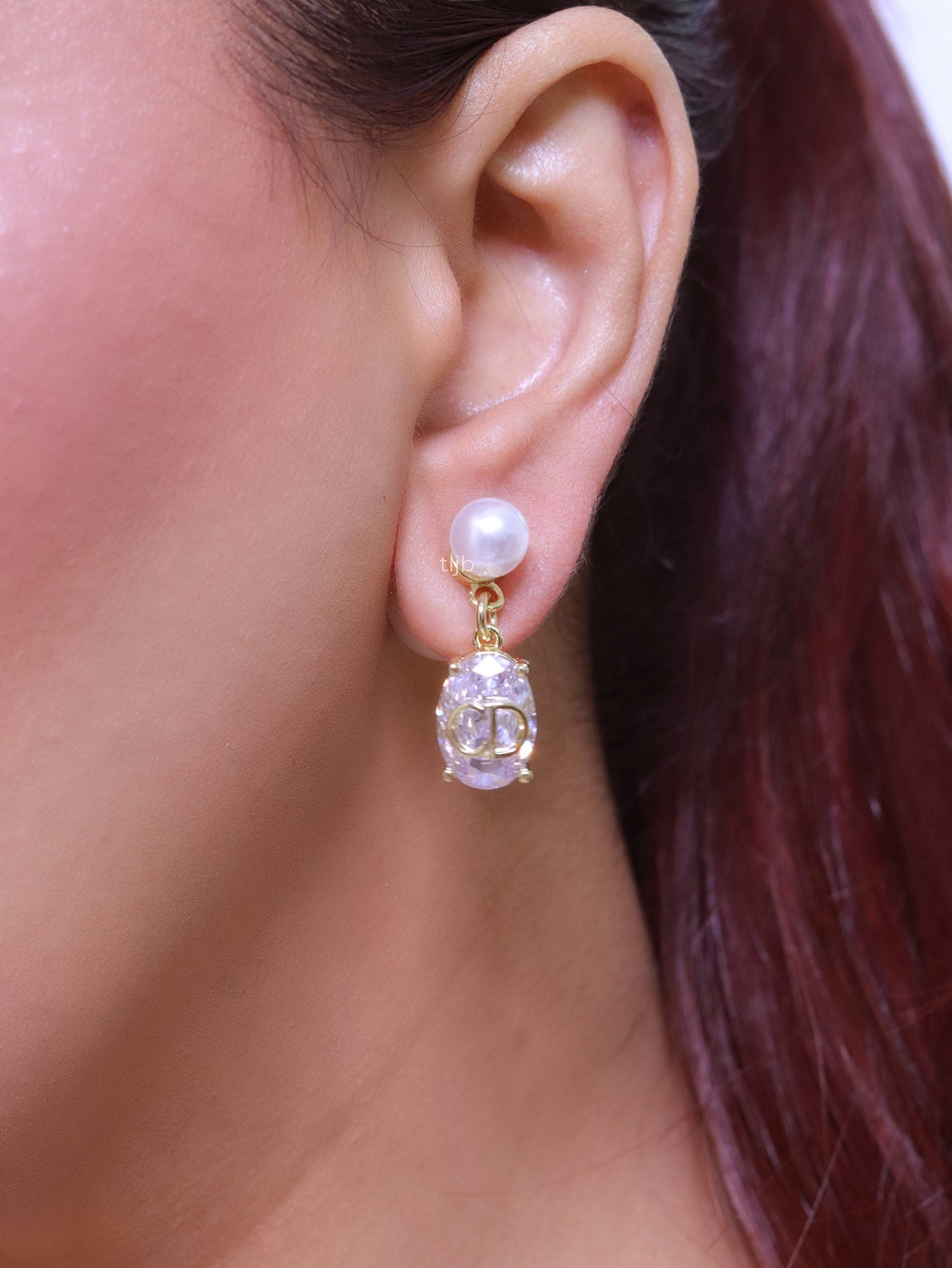 Alphabet C and D dangling stone pearl studs in platinum finish