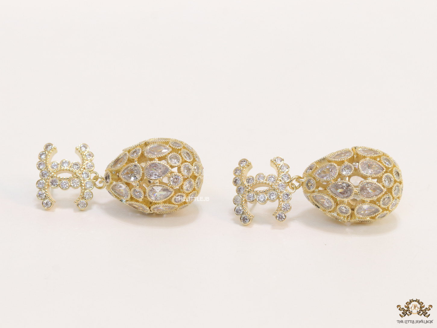 Golden twin C cz earrings with fancy cz lobe shape drops