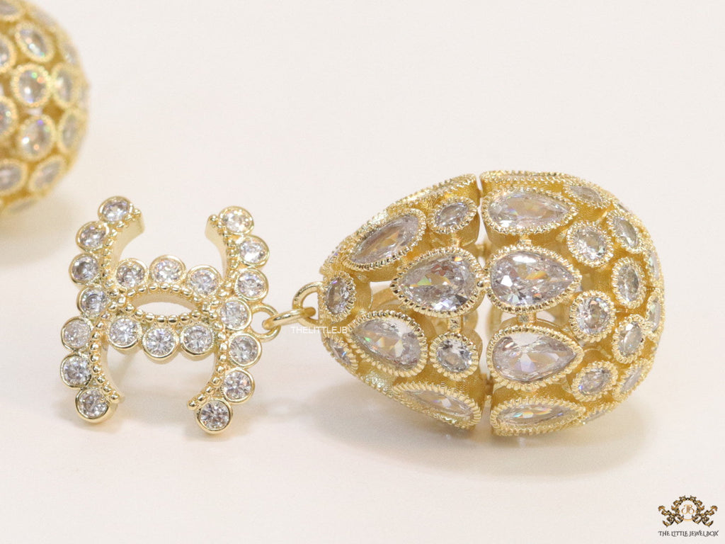 Golden twin C cz earrings with fancy cz lobe shape drops