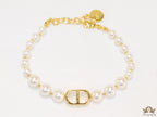 White pearl bracelet with gold plated alphabet motif