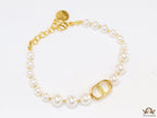 White pearl bracelet with gold plated alphabet motif