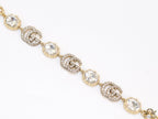 Gold plated linked chain bracelet with gold plated cubic zirconia stones twin G alphabet motifs and gold plated cubic zirconia stones