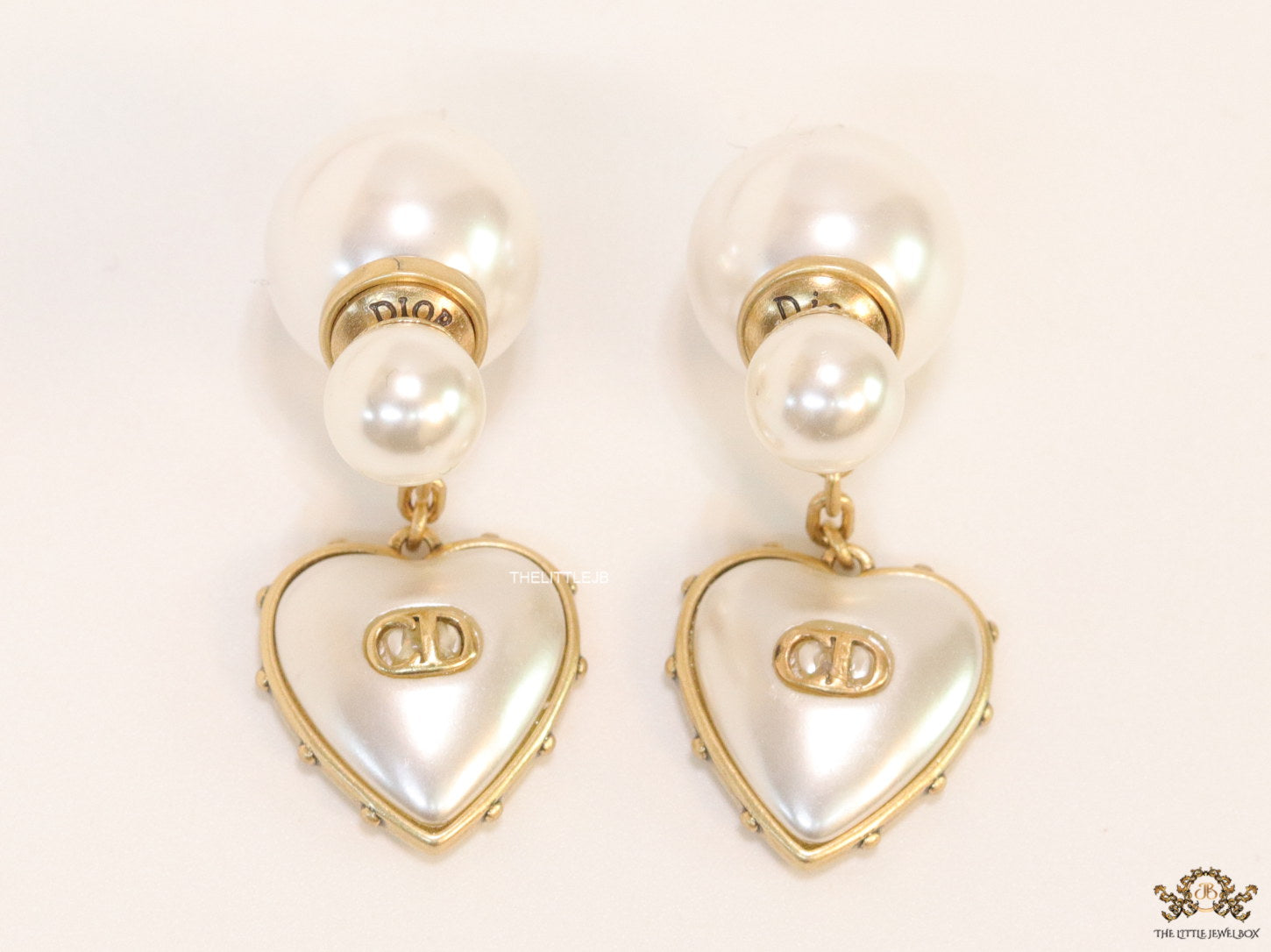 Gold plated pearl bomber earrings with MOP heart drop