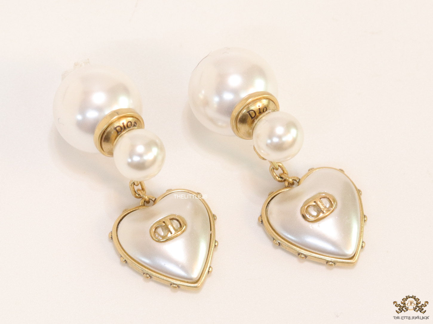 Gold plated pearl bomber earrings with MOP heart drop