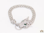 Platinum plated bracelet with cubic zirconia stones panther face motif with green cubic zirconia stone details and cubic zirconia stones disc
