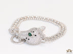 Platinum plated bracelet with cubic zirconia stones panther face motif with green cubic zirconia stone details and cubic zirconia stones disc