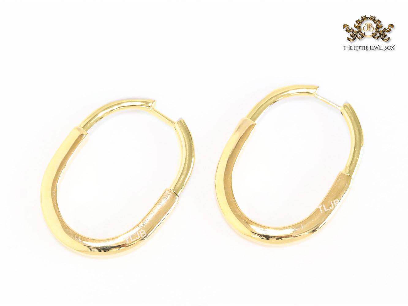 Alphabet T & Co. gold and cz oval hoops