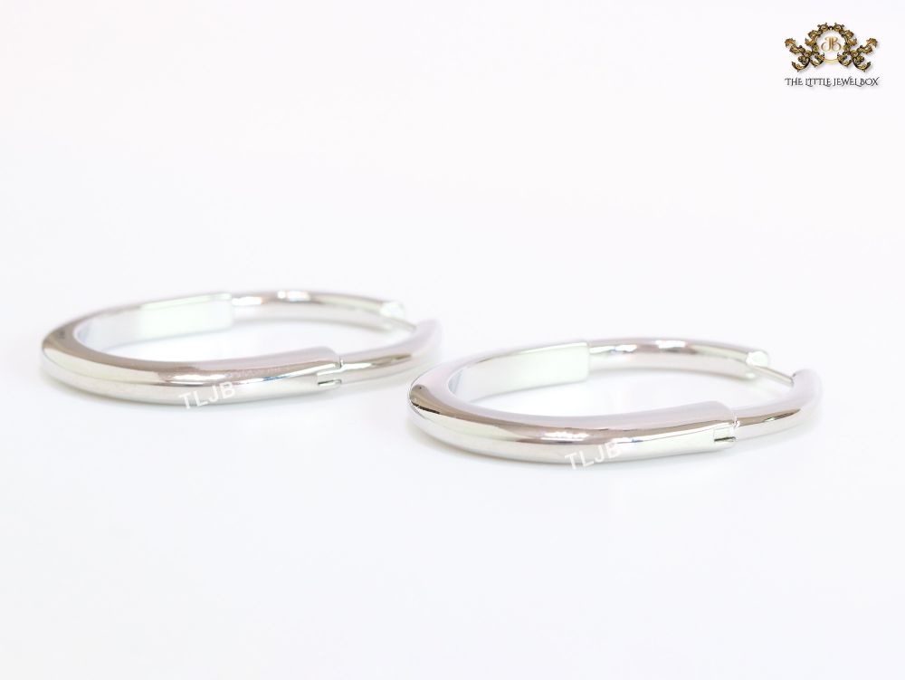 Alphabet T & Co. platinum and cz oval hoops