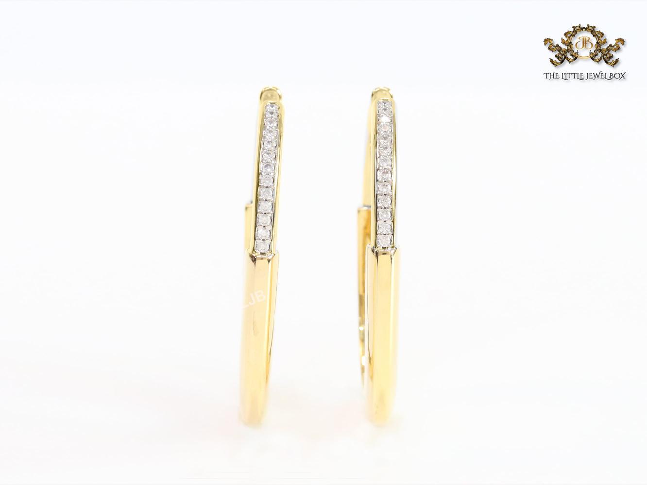 Alphabet T & Co. gold and cz oval hoops