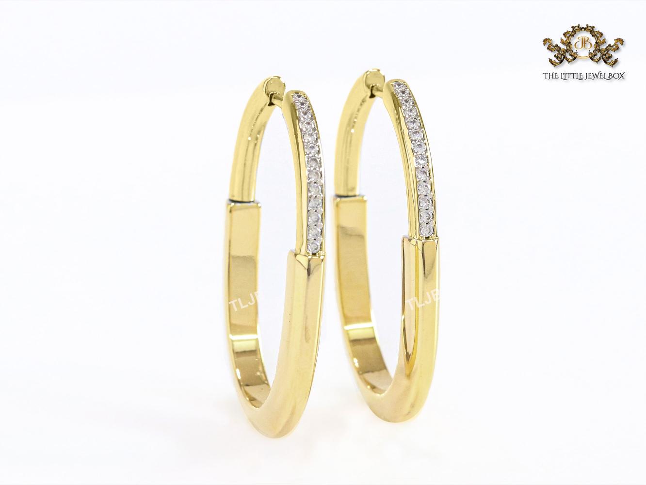 Alphabet T & Co. gold and cz oval hoops