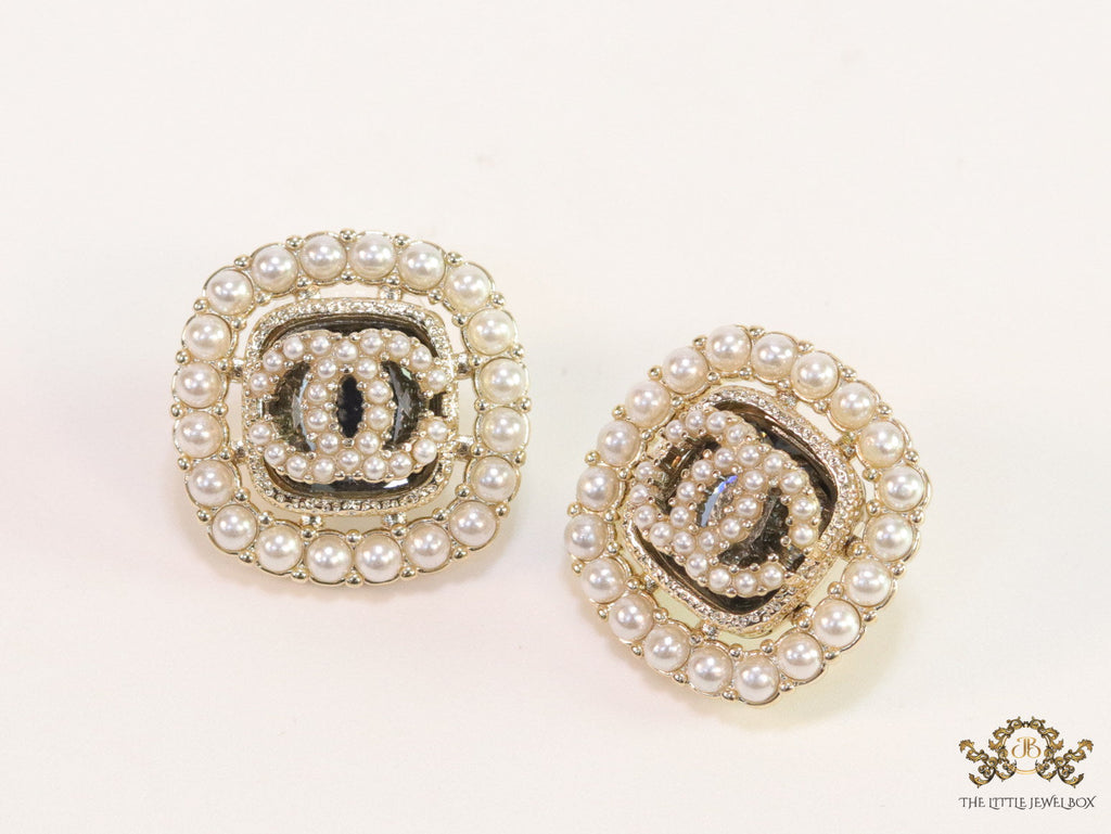 Pearl and cz studs with twin C motif
