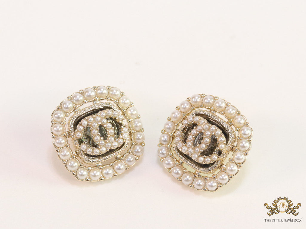 Pearl and cz studs with twin C motif