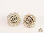 Pearl and cz studs with twin C motif