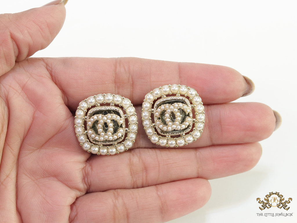 Pearl and cz studs with twin C motif