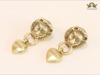 Antique lion face heart dangles
