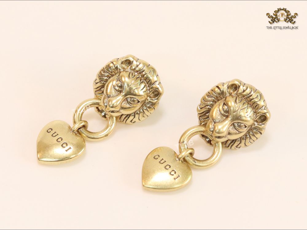 Antique lion face heart dangles