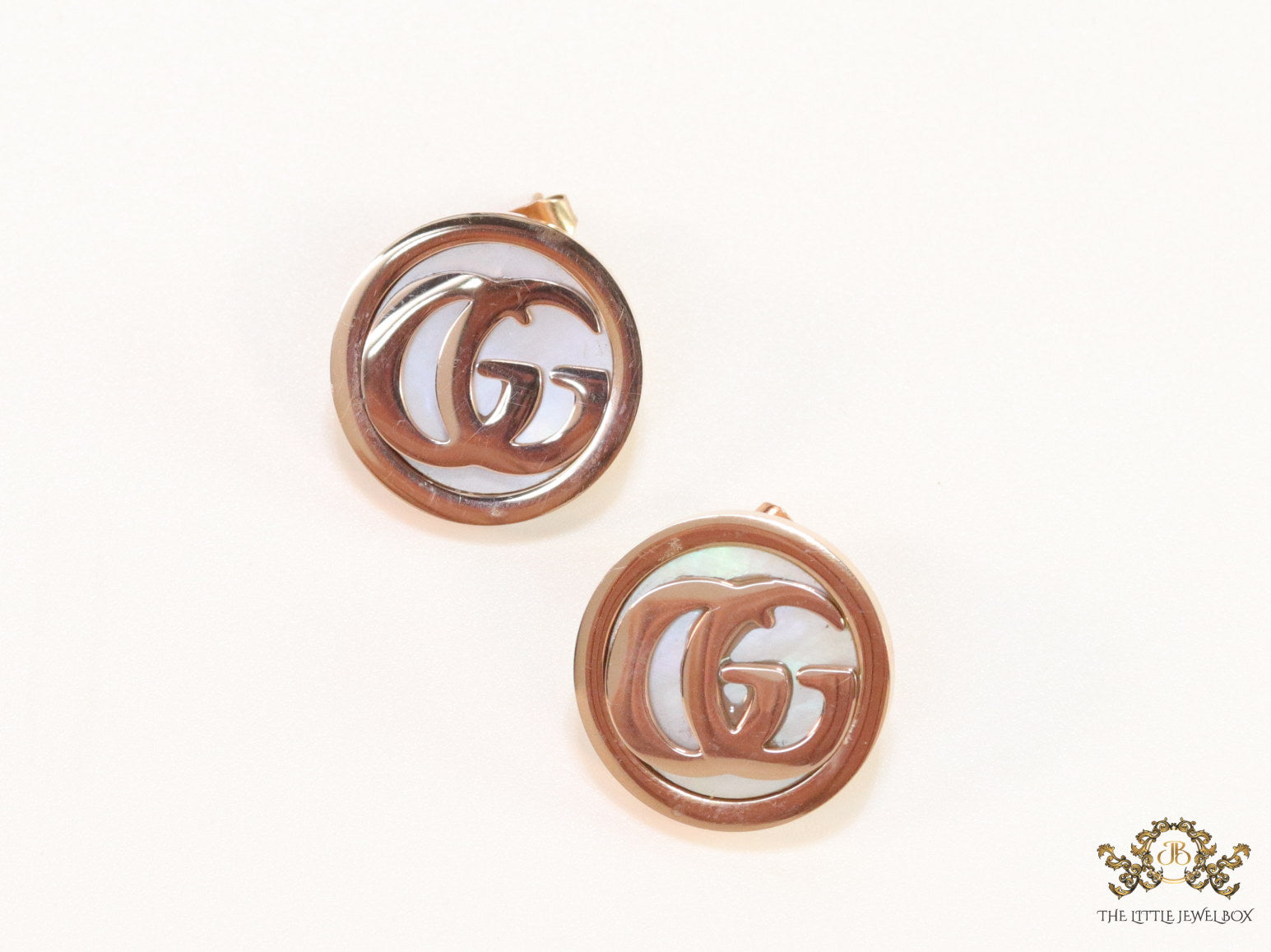 Rose gold plated twin G motif studs with MOP