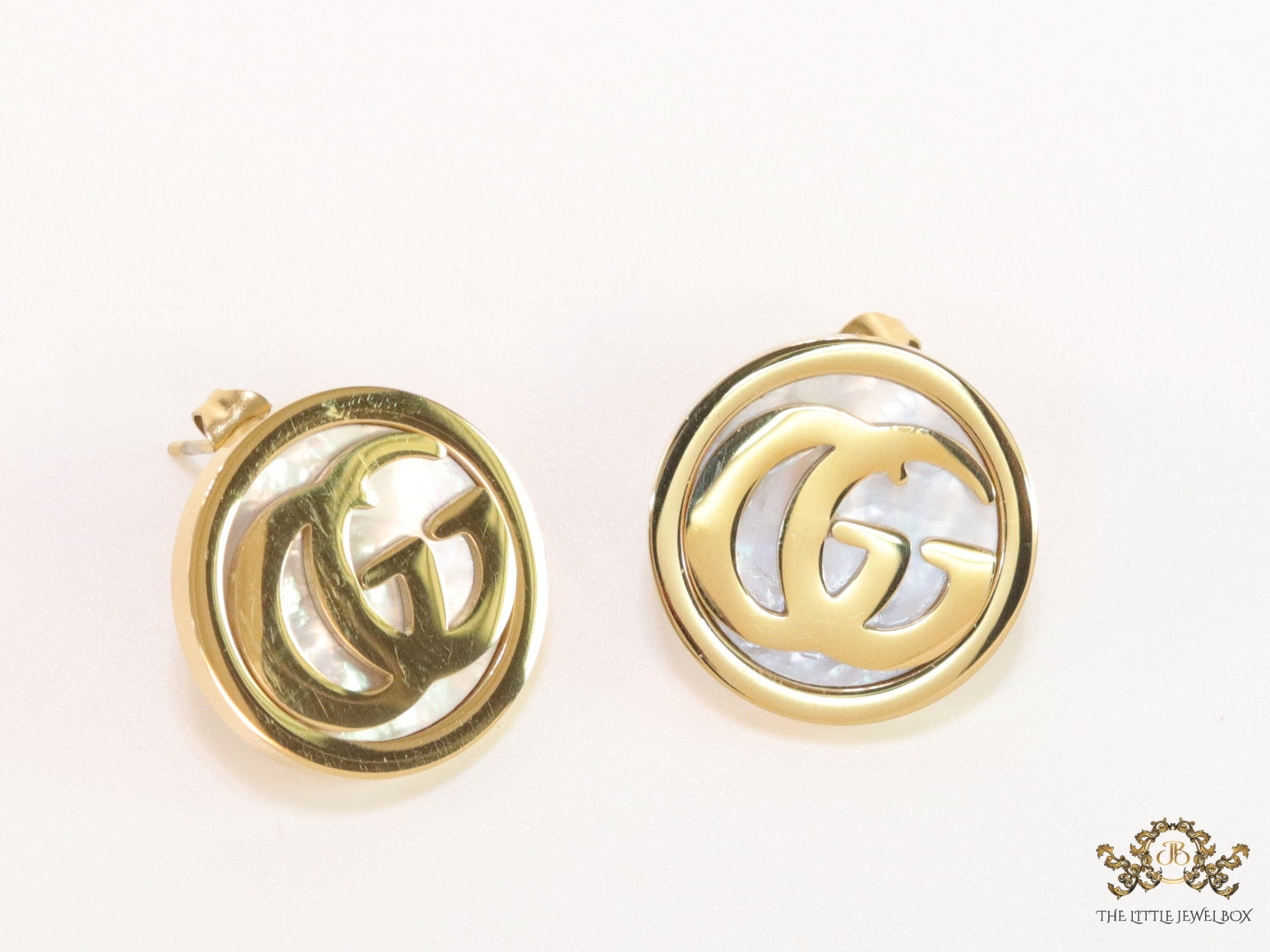 Gold plated twin G motif studs with MOP