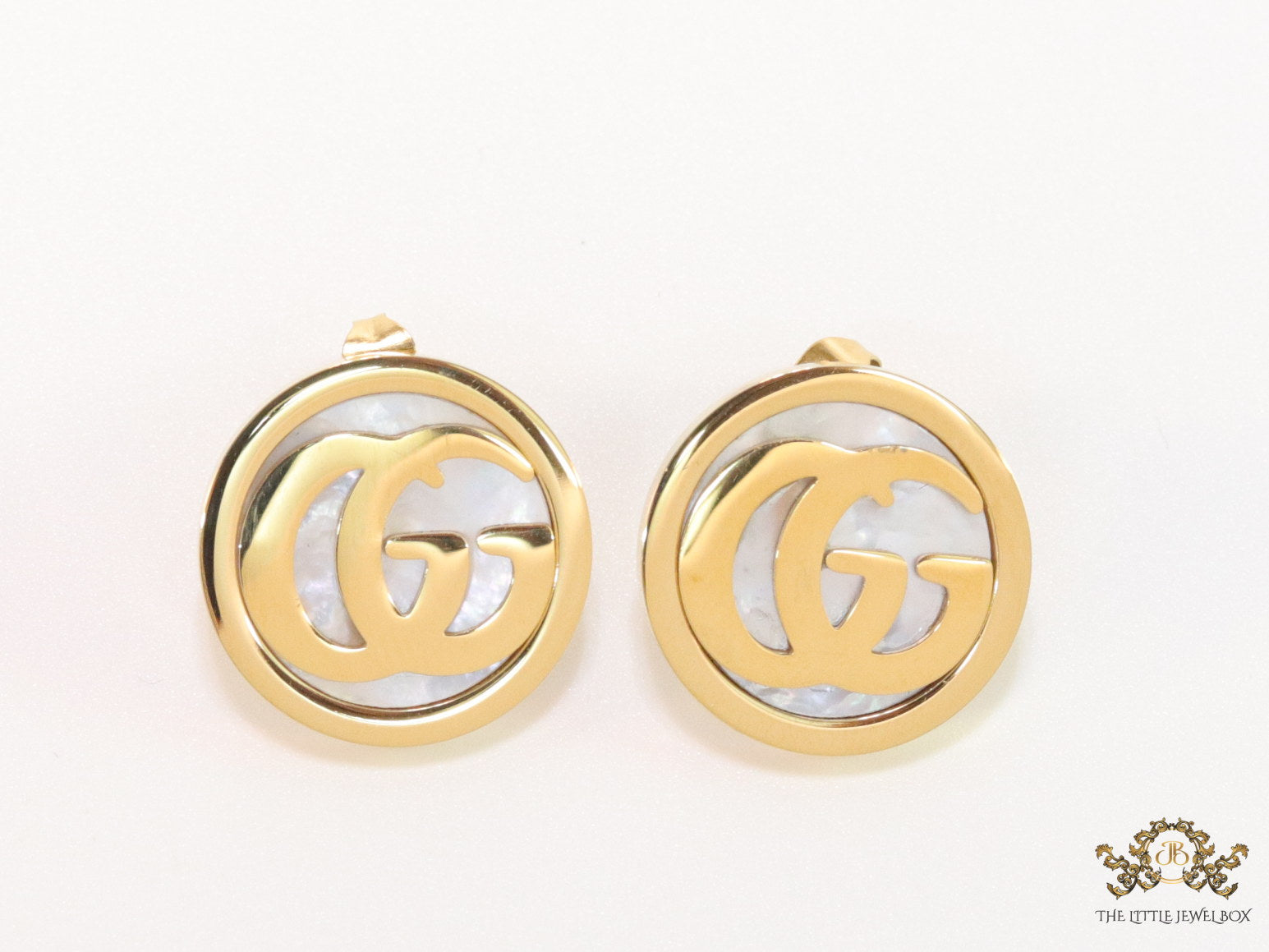 Gold plated twin G motif studs with MOP