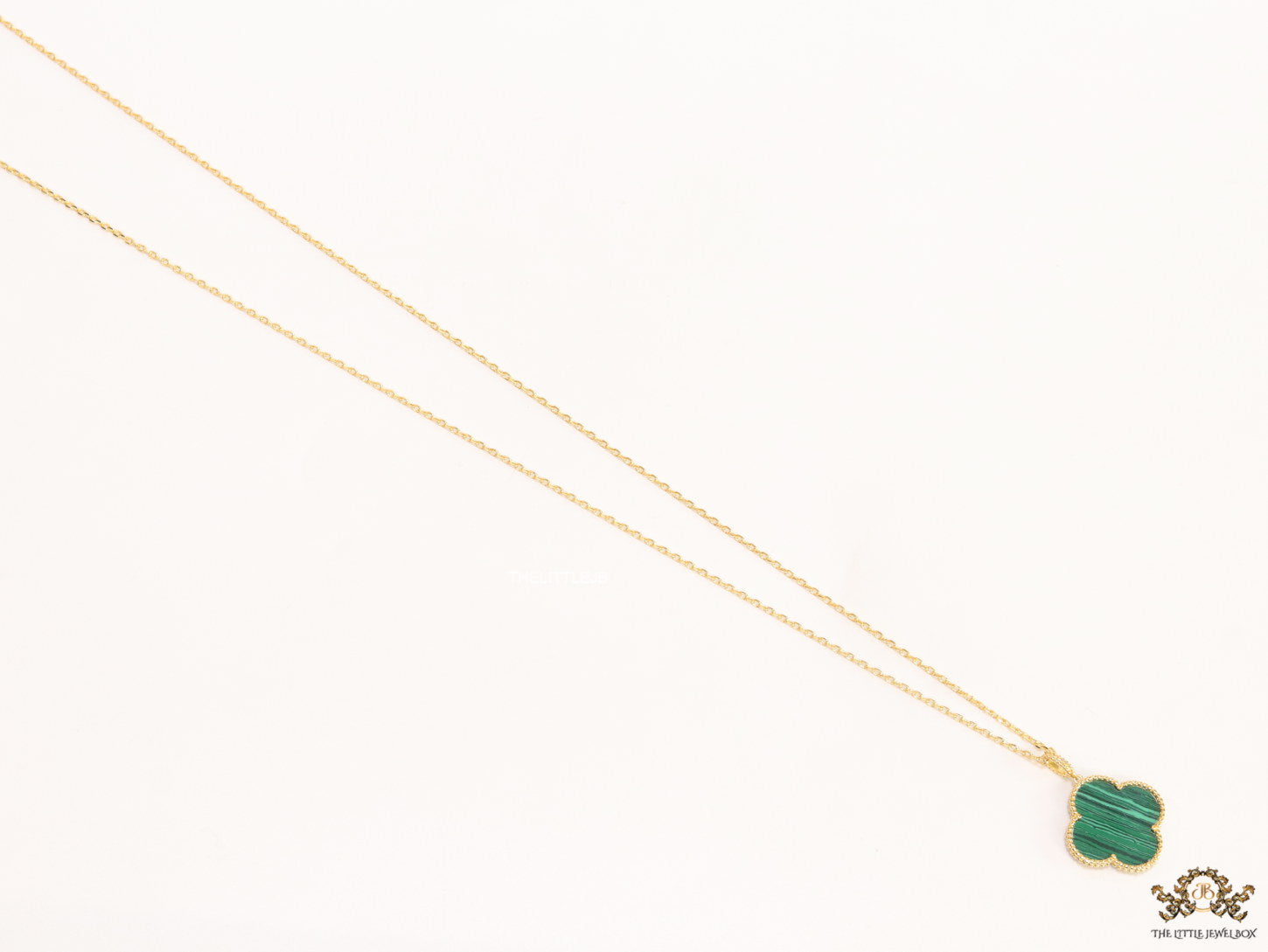 Malachite green clover pendant in gold plated chain