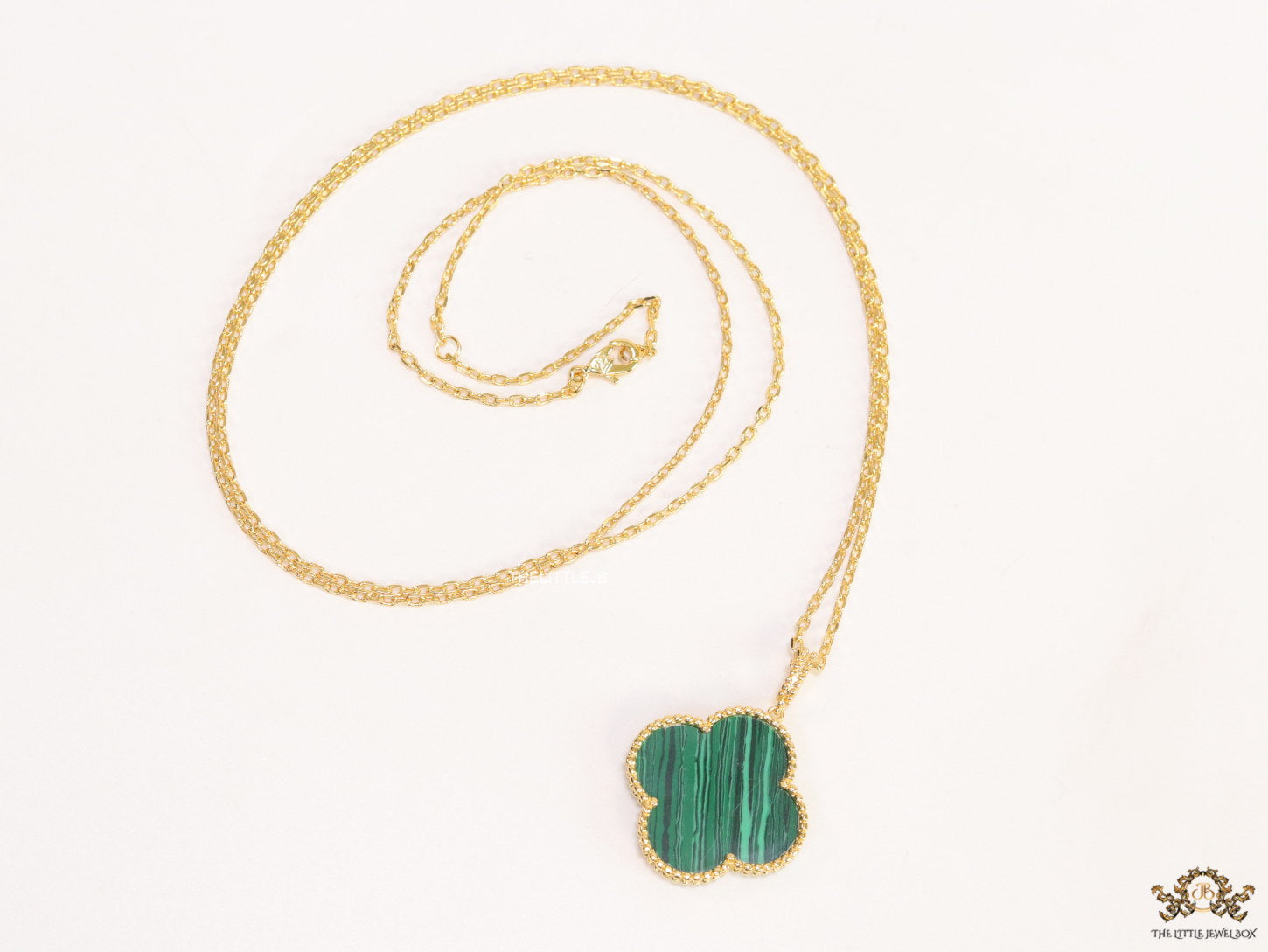 Malachite green clover pendant in gold plated chain