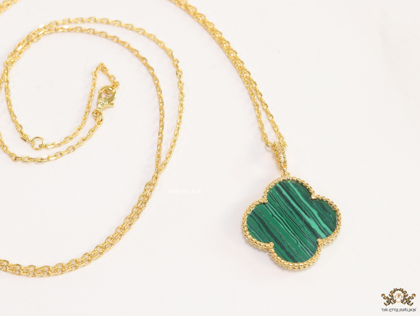 Malachite green clover pendant in gold plated chain