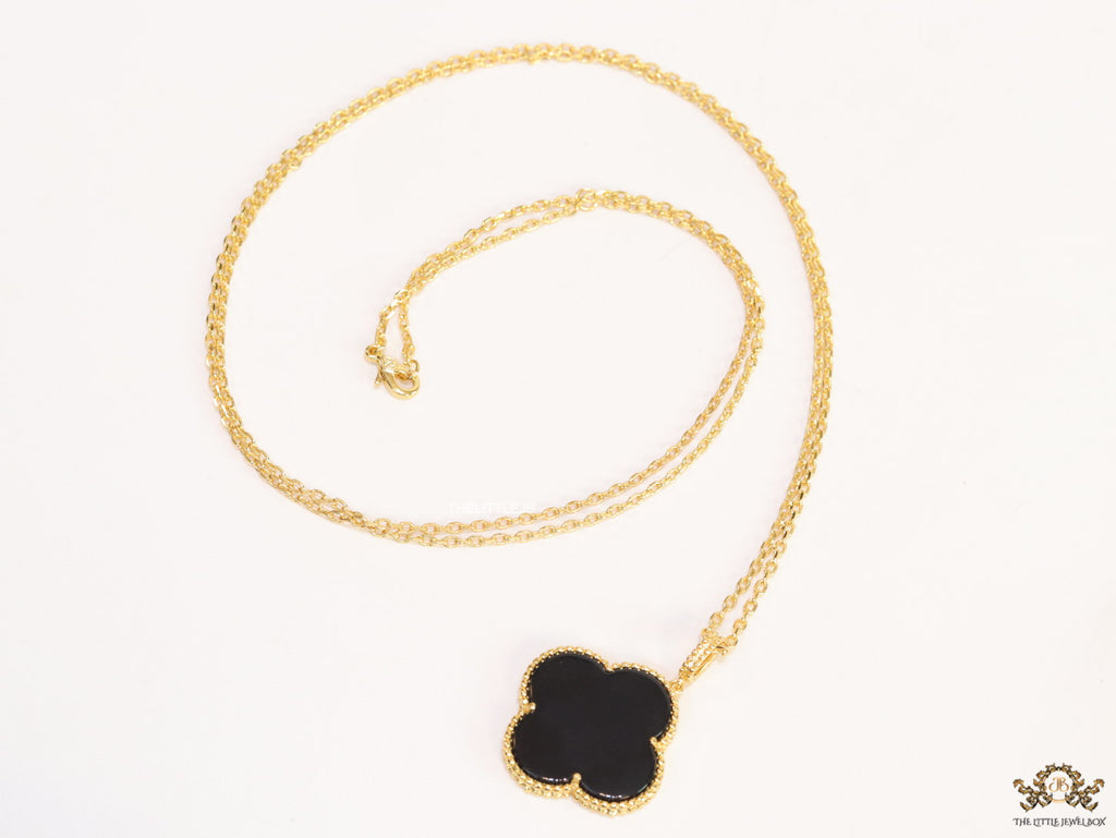 Black enamel clover pendant in gold plated chain