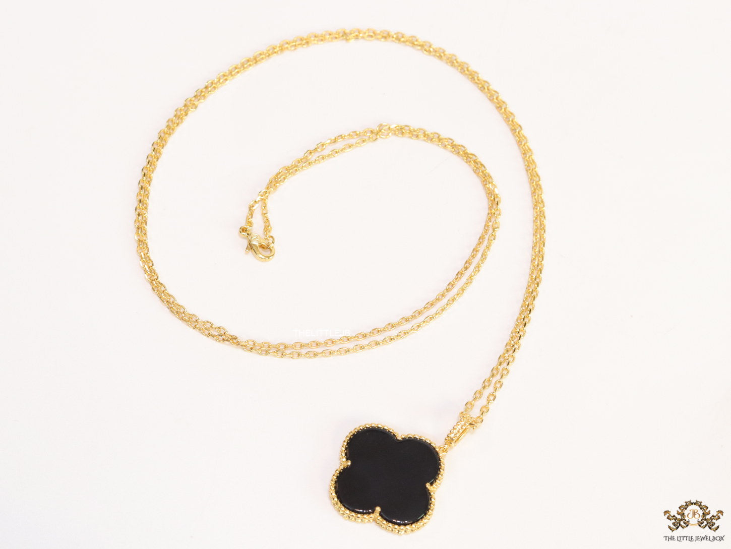 Black enamel clover pendant in gold plated chain