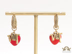 Golden hoops with alphabets and red pearl drop