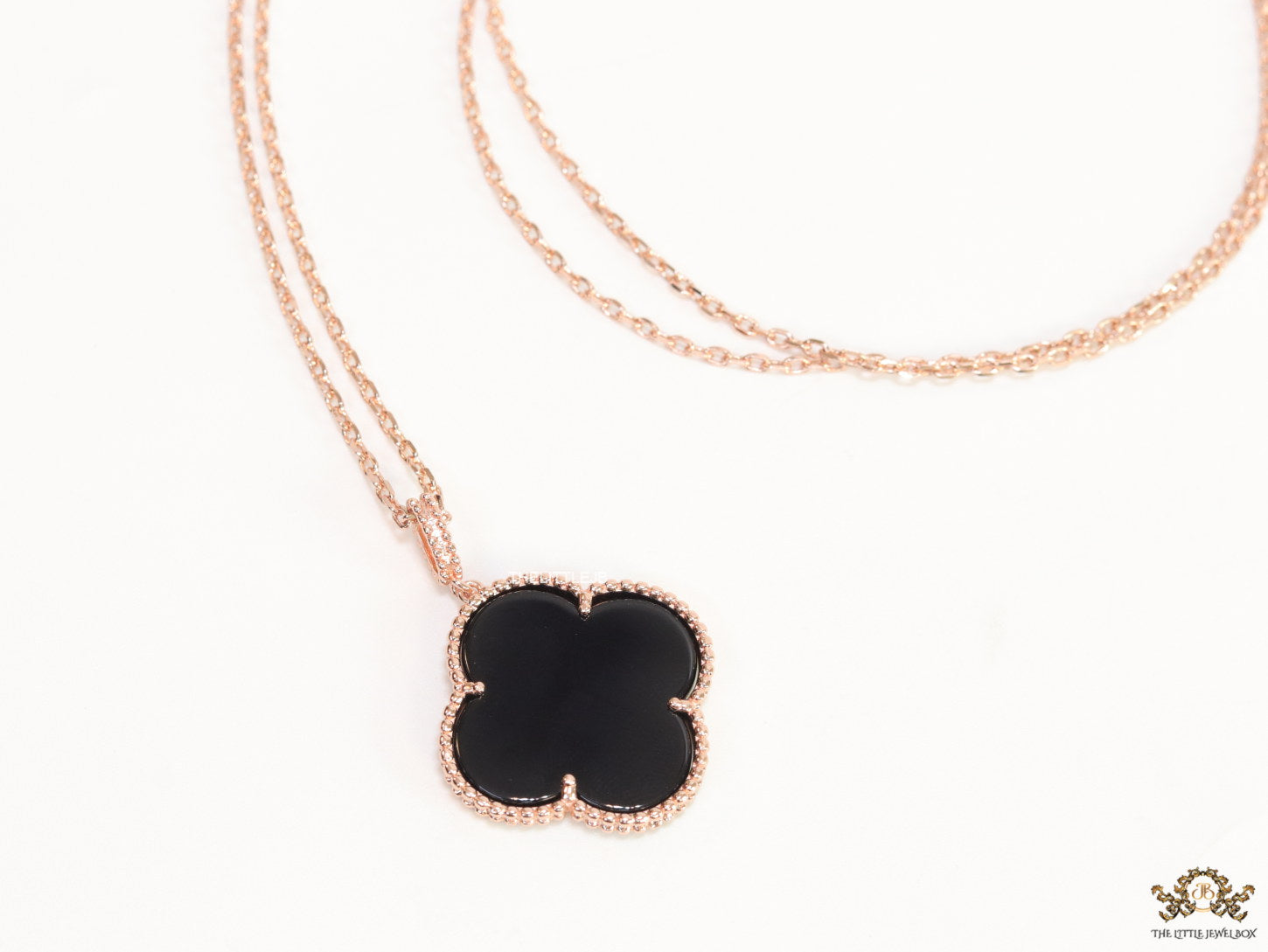 Black enamel clover pendant in rose gold plated chain