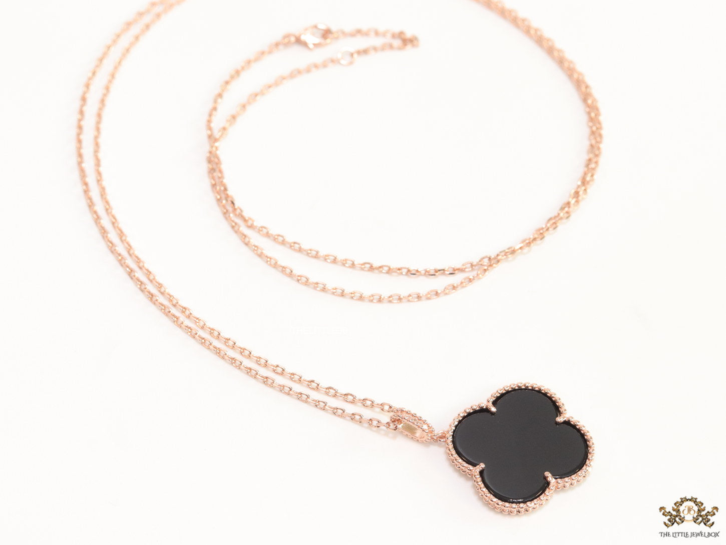 Black enamel clover pendant in rose gold plated chain