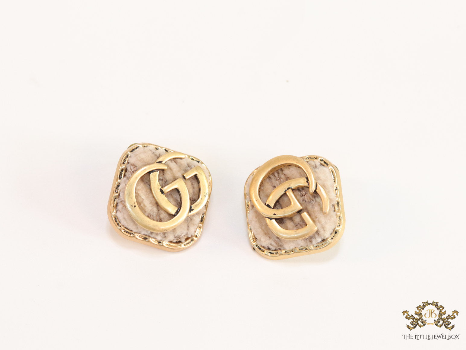 Cream velvet fur studs with golden twin G motif