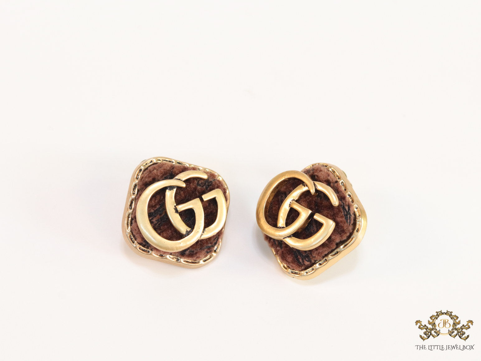 Brown velvet fur studs with golden twin G motif
