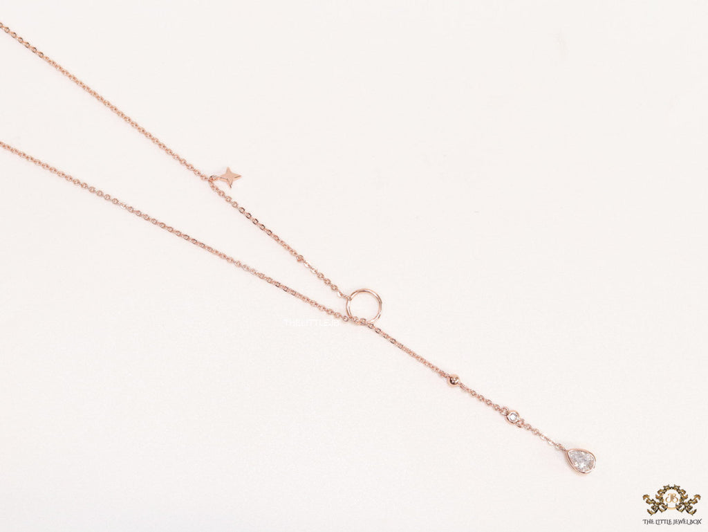 Platinum knot necklace with cz drop and small charms