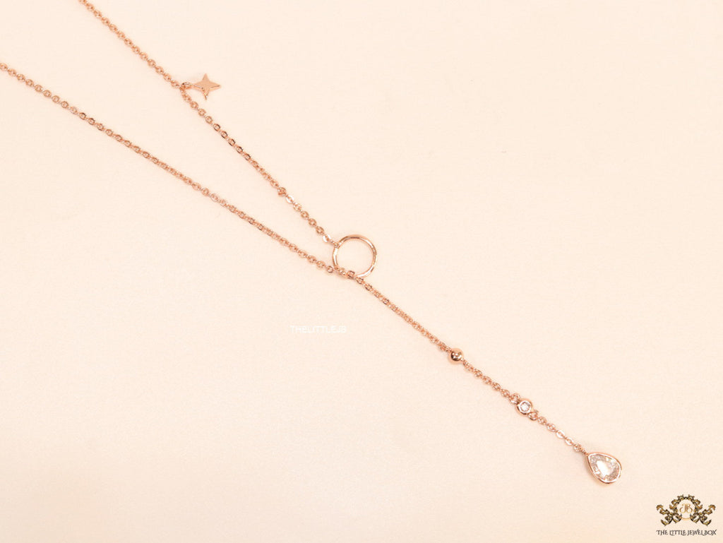 Platinum knot necklace with cz drop and small charms